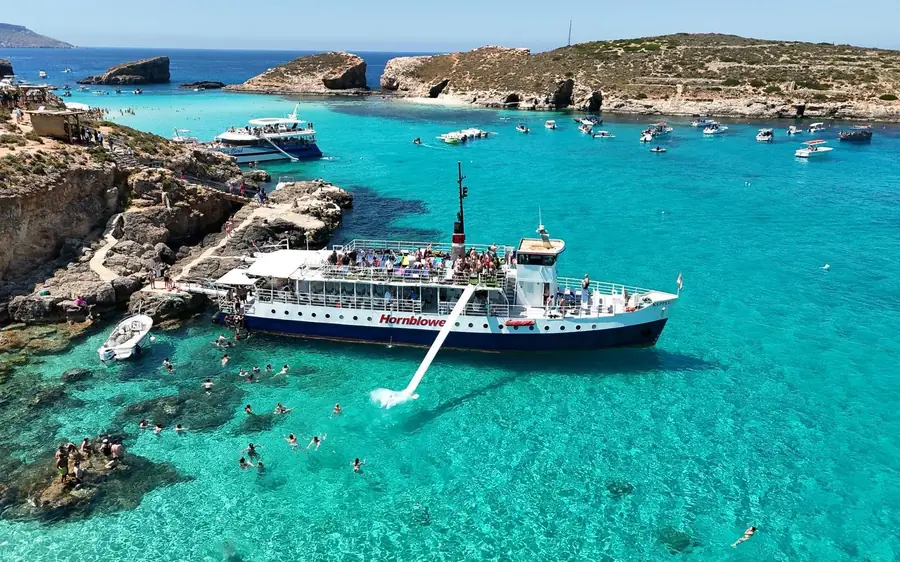 Boats moored in the turquoise water of the Blue Lagoon