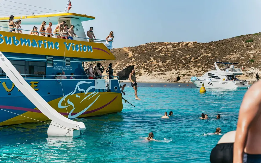 A tour boat with a waterslide moored at the Blue Lagoon